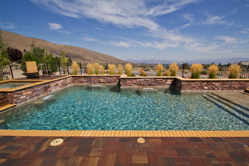 Custom pool with water feature installed by Robert Allen Pools and Spas